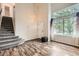 Inviting living room with high ceilings, large windows, and staircase at 1842 Reliance Cir, Superior, CO 80027