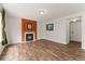 Cozy living room featuring a fireplace, hardwood floors, and bright lighting at 1842 Reliance Cir, Superior, CO 80027