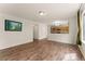Open living room and kitchen area featuring hardwood floors and bright lighting at 1842 Reliance Cir, Superior, CO 80027
