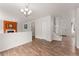 Open-concept living space features a fireplace, staircase, and seamless flow to the dining area and entrance at 1842 Reliance Cir, Superior, CO 80027