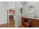 Interior shot of the home showing a vanity and a view into the kitchen at 381 Rainbow Ln, Lafayette, CO 80026