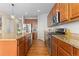 Gourmet kitchen with granite countertops, stainless steel appliances, and hardwood floors at 381 Rainbow Ln, Lafayette, CO 80026