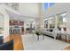 Open-concept layout showcasing living room connecting to kitchen and dining area with lots of natural light at 381 Rainbow Ln, Lafayette, CO 80026