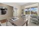 Inviting home office featuring a large desk, comfortable seating, and ample natural light from the window at 381 Rainbow Ln, Lafayette, CO 80026