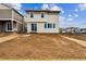 Exterior shot of the backyard of this two-story home with a slider at 9237 Truckee Ct, Commerce City, CO 80022