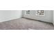 A spacious bedroom featuring neutral carpet and bright, natural light at 9237 Truckee Ct, Commerce City, CO 80022