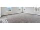 A bedroom with ample natural light from several windows and neutral carpet at 9237 Truckee Ct, Commerce City, CO 80022