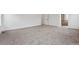 A bedroom featuring neutral carpeting and an en-suite bathroom at 9237 Truckee Ct, Commerce City, CO 80022
