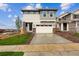 New construction two-story home with stone accents and a two-car garage at 9237 Truckee Ct, Commerce City, CO 80022
