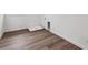 A laundry room featuring wood-look floors and new, modern hook-ups at 9237 Truckee Ct, Commerce City, CO 80022