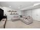 Finished basement boasting a large sectional couch and open floor plan at 3039 W Denver Pl, Denver, CO 80211