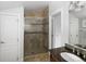Bathroom with a tiled shower and stylish fixtures at 3039 W Denver Pl, Denver, CO 80211
