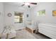 Bright Bedroom with a crib, daybed, and plenty of natural light at 3039 W Denver Pl, Denver, CO 80211