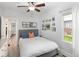 Bedroom with natural light, ceiling fan, and neutral decor at 3039 W Denver Pl, Denver, CO 80211