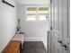Bright entryway with storage bench and coat hooks by the door at 3039 W Denver Pl, Denver, CO 80211