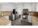 Well-equipped kitchen with stainless steel appliances and granite countertops at 3039 W Denver Pl, Denver, CO 80211