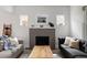 Comfortable living room with a modern fireplace and neutral color palette at 3039 W Denver Pl, Denver, CO 80211