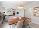 Bright living room with wood table and plenty of natural light at 3039 W Denver Pl, Denver, CO 80211
