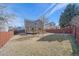 Expansive backyard with lawn, patio and wood fence provides privacy at 5253 S Jericho St, Centennial, CO 80015