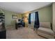 Relaxing bedroom features a comfortable chair, neutral carpet, and bright window at 5253 S Jericho St, Centennial, CO 80015