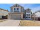 Charming two-story home with a well-maintained lawn and attached two-car garage at 5253 S Jericho St, Centennial, CO 80015