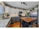 Well-lit kitchen with stainless steel appliances, butcher block island, and abundant counter space at 5253 S Jericho St, Centennial, CO 80015