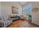 Bright and airy living room with high ceilings, hardwood floors, and large windows at 5253 S Jericho St, Centennial, CO 80015