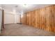 Spacious basement with wood paneling, carpet flooring, and neutral walls at 547 S 3Rd Avenue, Brighton, CO 80601