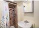 Cozy bathroom with shower stall, curtain and vanity with a sink and mirror at 547 S 3Rd Avenue, Brighton, CO 80601