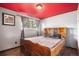 Cozy bedroom features wood floors, neutral walls, and a large bed for comfortable sleeping and relaxation at 547 S 3Rd Avenue, Brighton, CO 80601