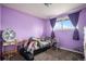 Bright bedroom with carpeted floors and large window, offering a comfortable and relaxing private space at 547 S 3Rd Avenue, Brighton, CO 80601