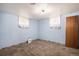 Bedroom with blue walls, carpet, and natural light from two windows at 547 S 3Rd Avenue, Brighton, CO 80601