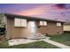 Charming single story brick home with a well-maintained front yard and concrete steps to the front door at 547 S 3Rd Avenue, Brighton, CO 80601