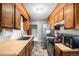 Functional kitchen features ample cabinet space, modern appliances, and durable flooring for easy maintenance at 547 S 3Rd Avenue, Brighton, CO 80601