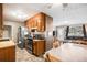 Functional kitchen with view to the living room features ample cabinet space, and modern appliances at 547 S 3Rd Avenue, Brighton, CO 80601