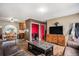 Comfortable living room and view to kitchen, featuring hardwood floors and stylish furniture for entertaining at 547 S 3Rd Avenue, Brighton, CO 80601