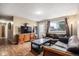 Inviting living room boasts hardwood floors and comfortable sofas, perfect for lounging and hosting guests at 547 S 3Rd Avenue, Brighton, CO 80601