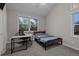 Bedroom with desk, chair and a bed next to a window at 15220 E Caley Ave, Centennial, CO 80016