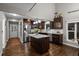 Stylish kitchen with island, stainless steel appliances, and hardwood floors at 15220 E Caley Ave, Centennial, CO 80016