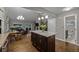 Open kitchen featuring island, granite countertops, and stainless appliances at 15220 E Caley Ave, Centennial, CO 80016