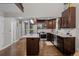Modern kitchen with island, stainless steel appliances, and dark cabinetry at 15220 E Caley Ave, Centennial, CO 80016