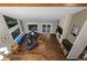 Aerial view of the living room features a fireplace, comfortable seating, and large windows at 15220 E Caley Ave, Centennial, CO 80016