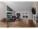 Bright living room with large windows overlooking the landscape and modern furnishings at 15220 E Caley Ave, Centennial, CO 80016