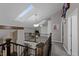 Open loft space with skylights, railing overlooking the downstairs, and a comfortable seating area at 15220 E Caley Ave, Centennial, CO 80016