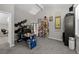 Home office room with a work area, shelves, gray walls and carpet at 15220 E Caley Ave, Centennial, CO 80016