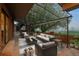 Outdoor patio with sofa, chairs, lighting, and firepit at 15220 E Caley Ave, Centennial, CO 80016