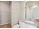 Modern bathroom with granite countertops, a walk-in shower, and ample storage space at 709 Twining Ave, Brighton, CO 80601