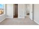 Spacious bedroom with plush carpeting, a large window, and a convenient closet at 709 Twining Ave, Brighton, CO 80601