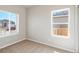 Well-lit bedroom with plush carpet and windows offering views of the surroundings at 709 Twining Ave, Brighton, CO 80601