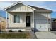 Charming single-story home with a well-maintained front yard and attached one car garage at 709 Twining Ave, Brighton, CO 80601
